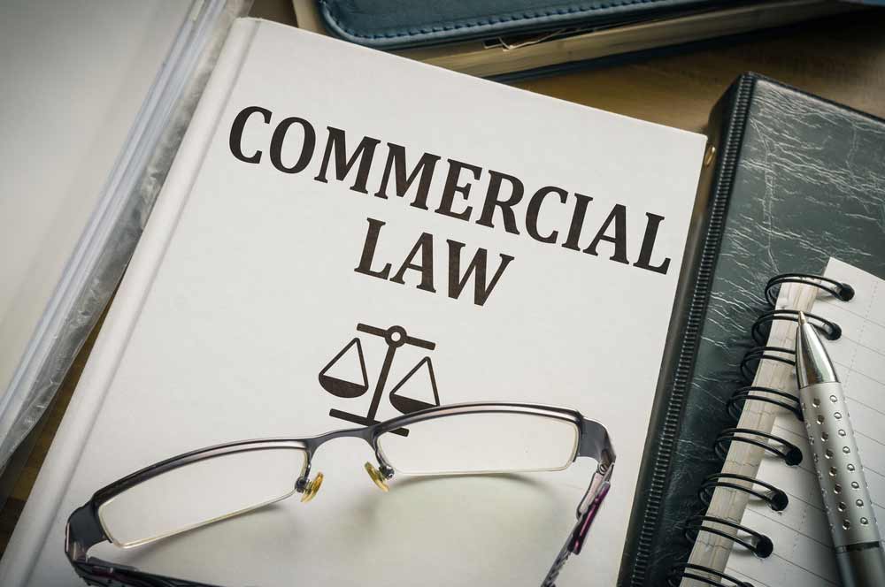 Commercial Law Book And An Eyeglasses