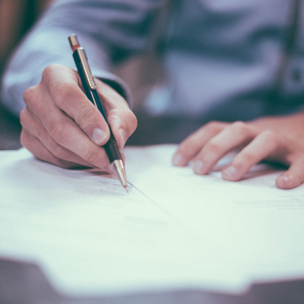 Lawyer Signing Documents